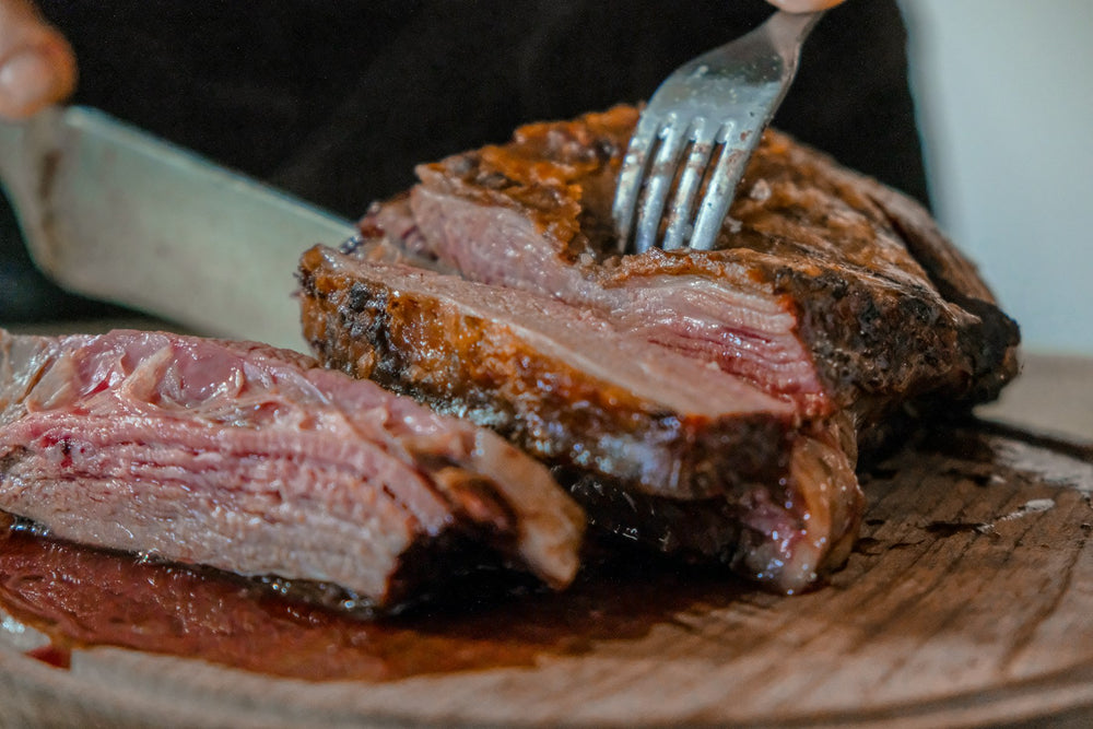 Sliced rare steak on a board