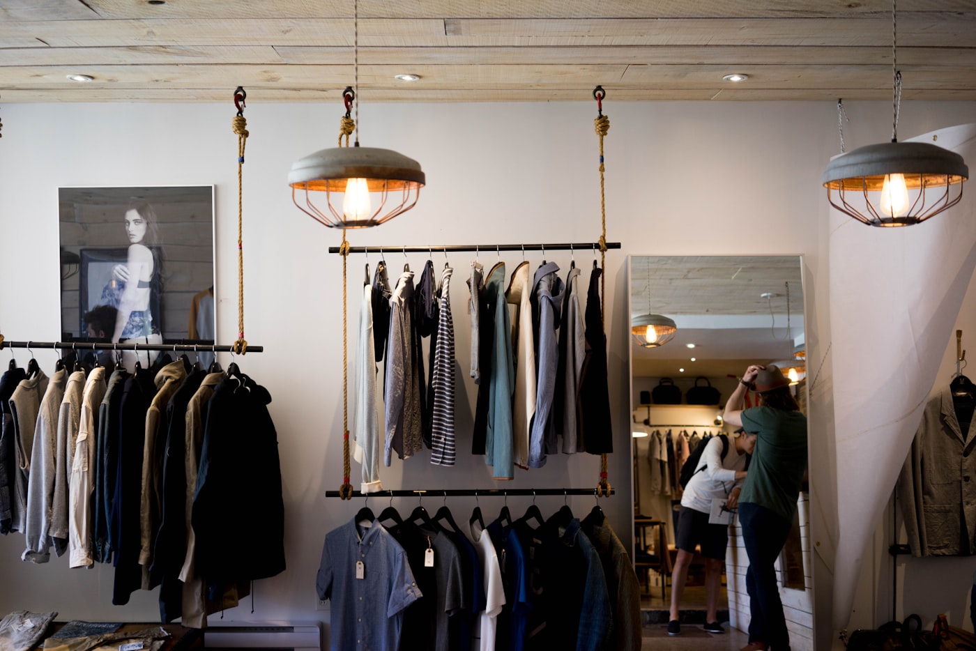 A styled shopfront rail of clothing