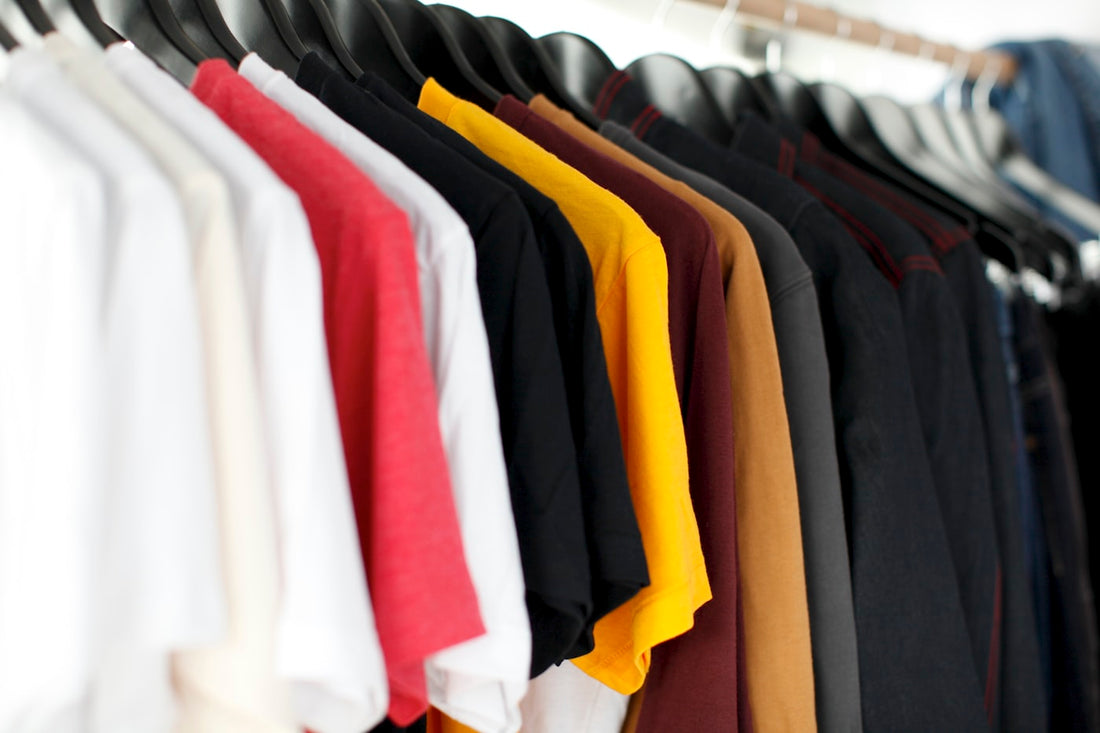 Colourful knitwear arranged on a rail