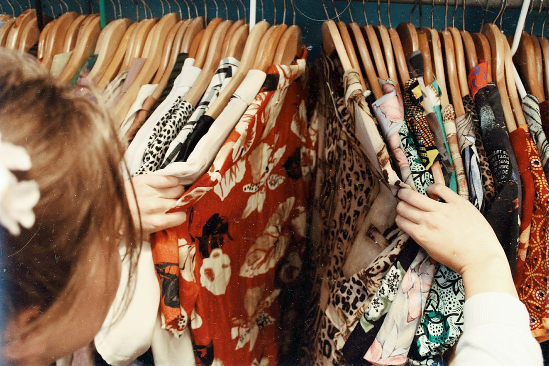 Browsing a rail of clothing