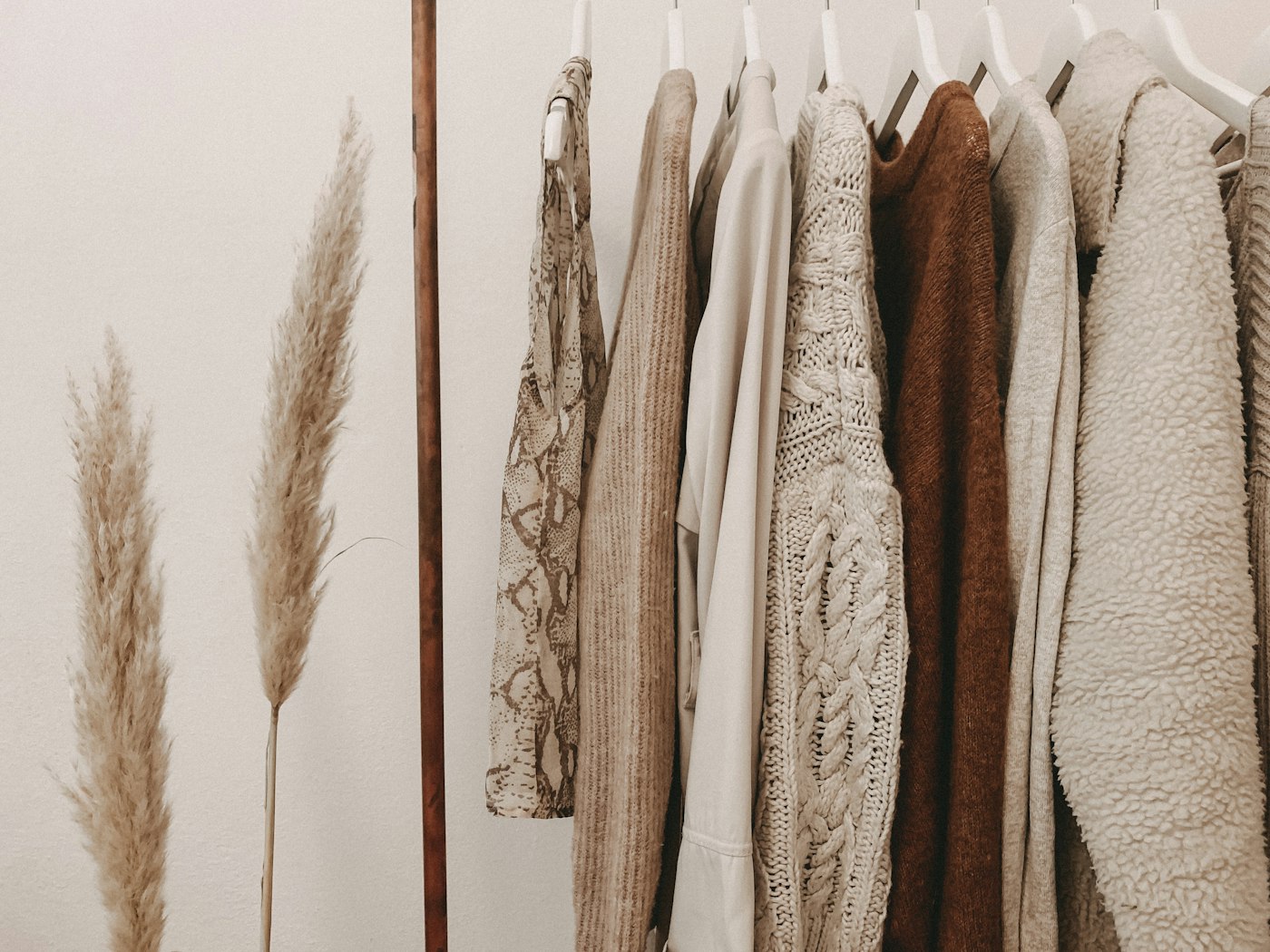 Neutral coats hanging on a rail