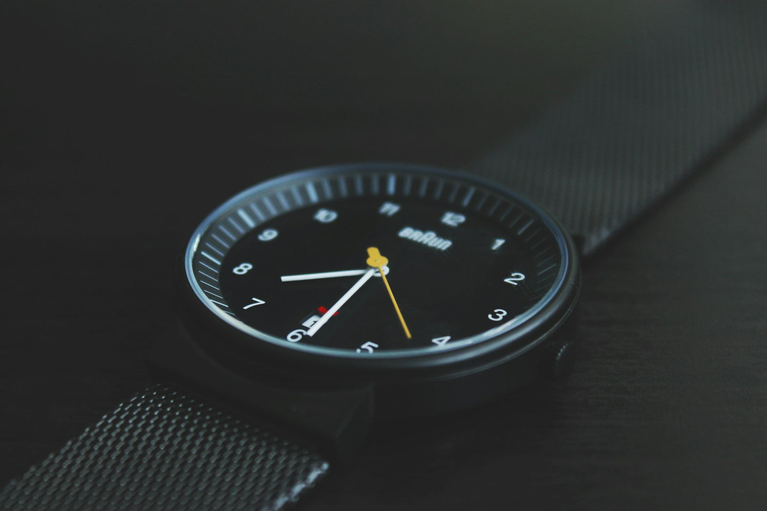 Minimal watch face on mesh strap