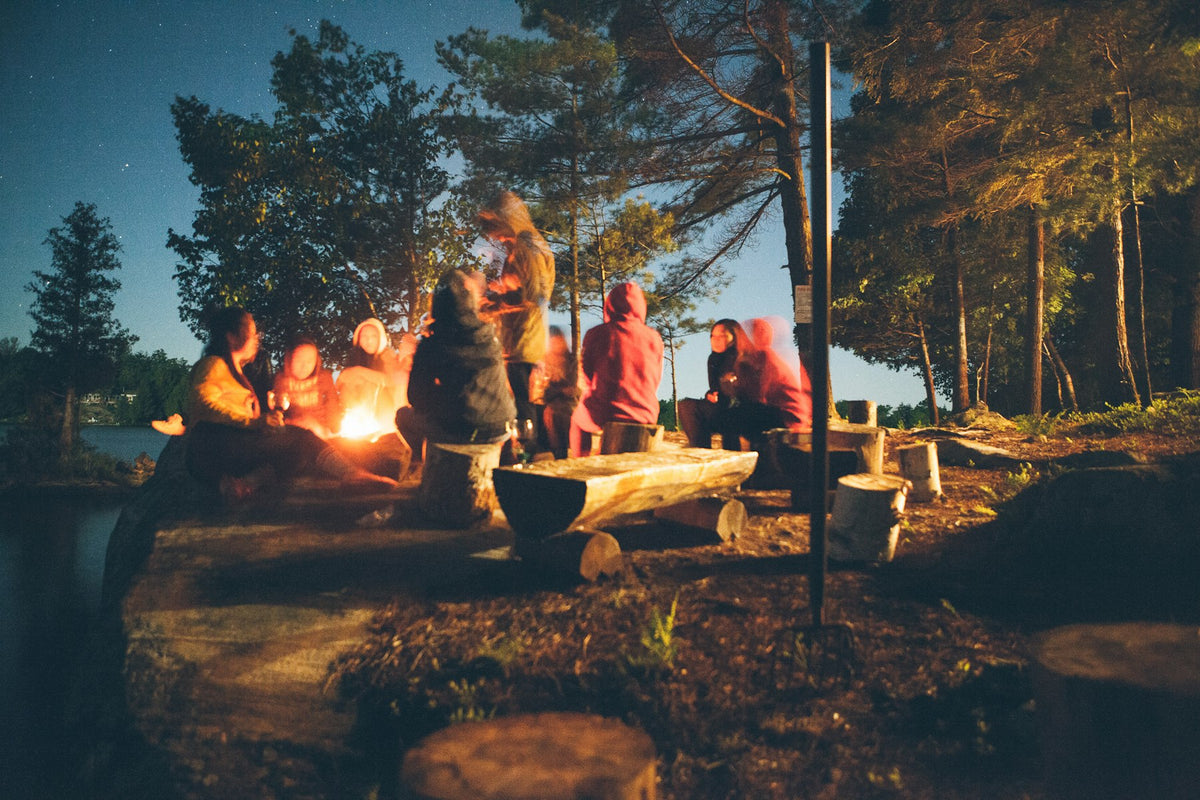 Group around a campfire at dusk