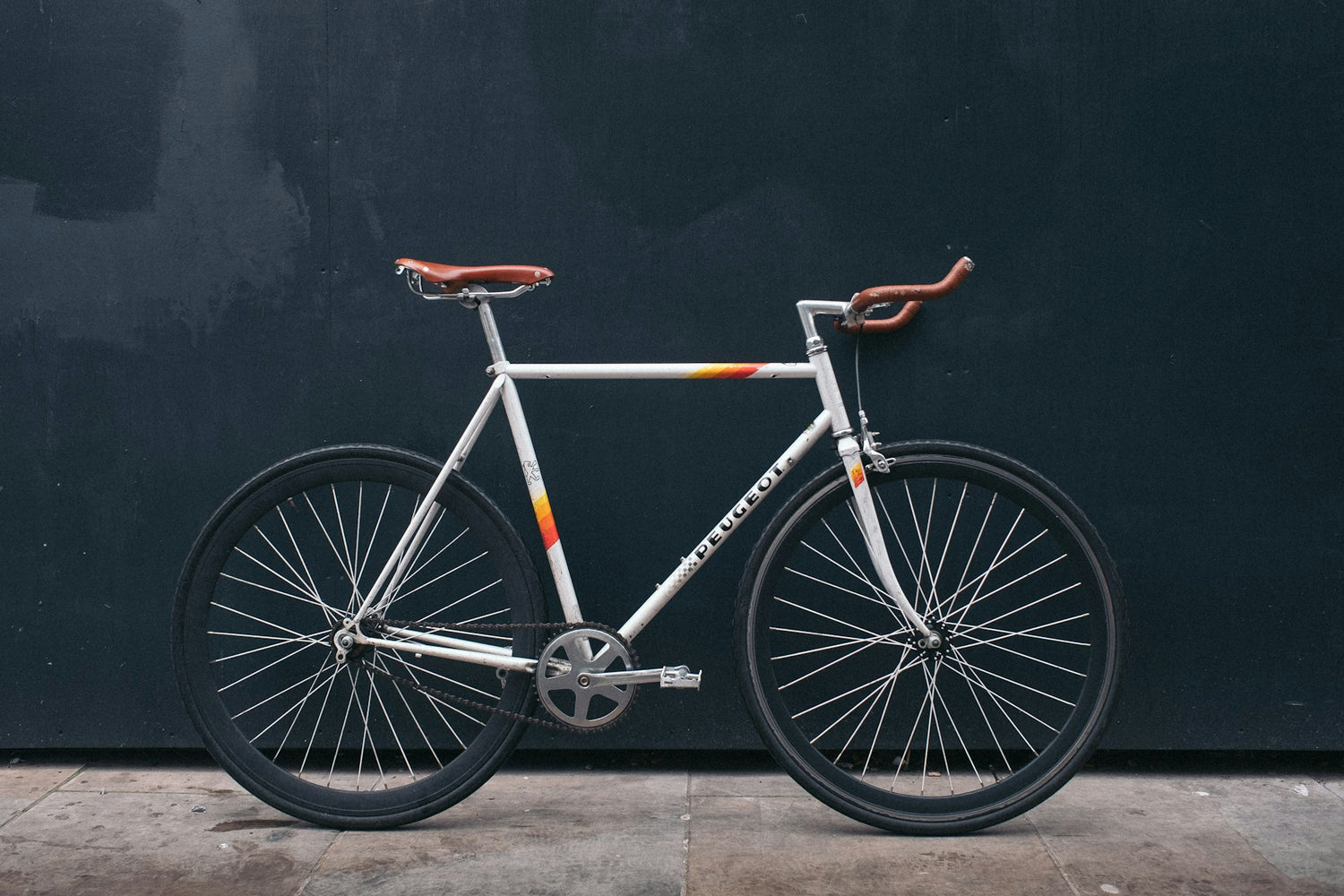 Road bike against a dark wall
