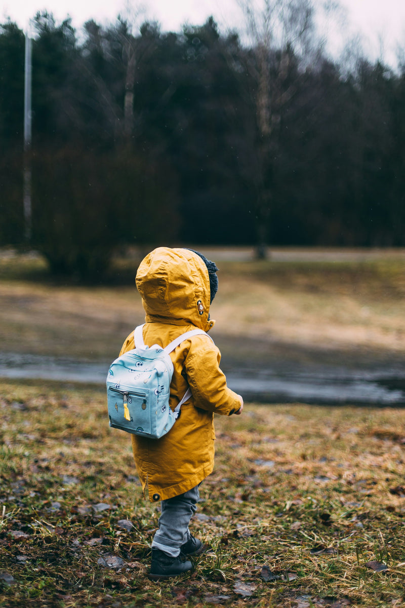 Toddler walking outdoors