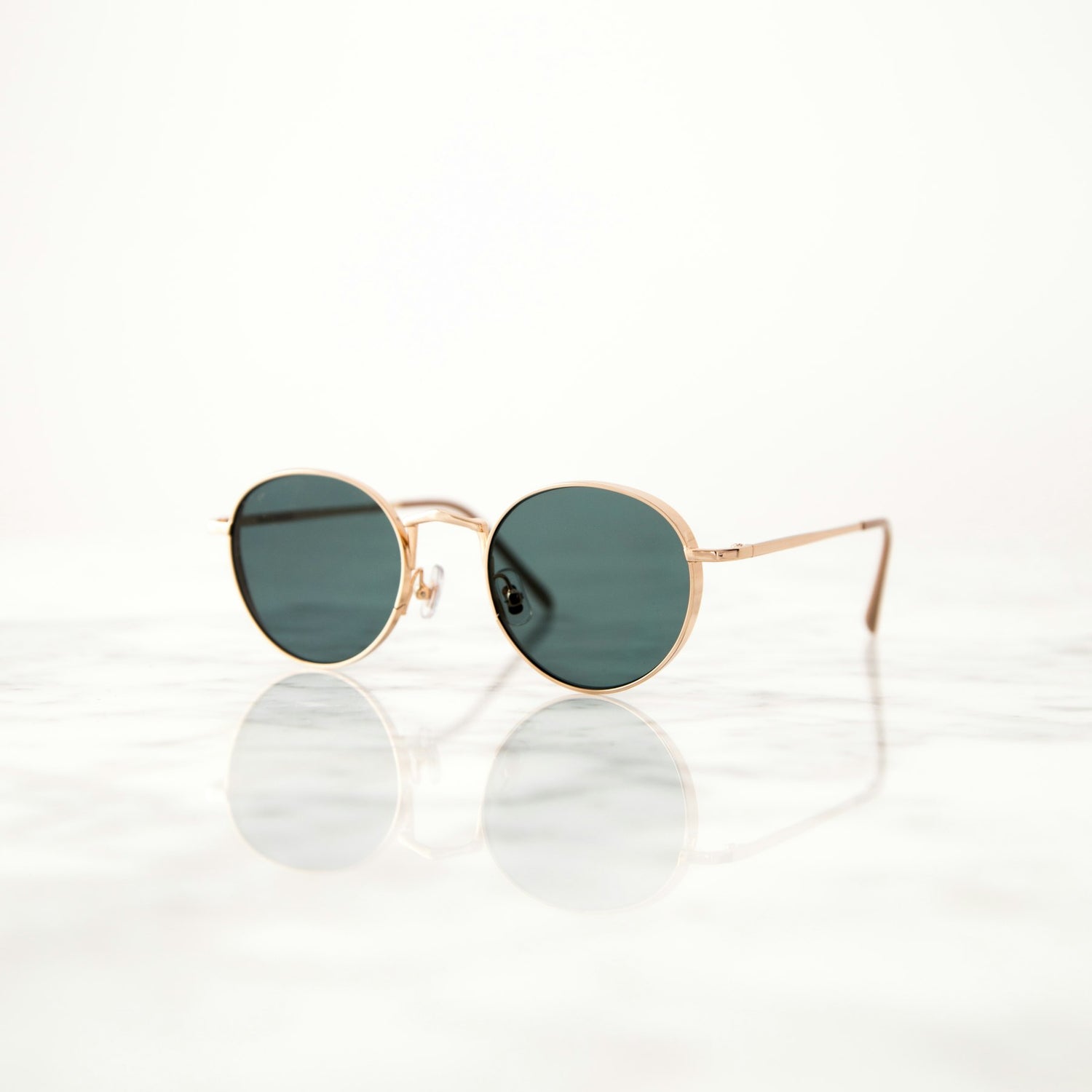 Round sunglasses on white