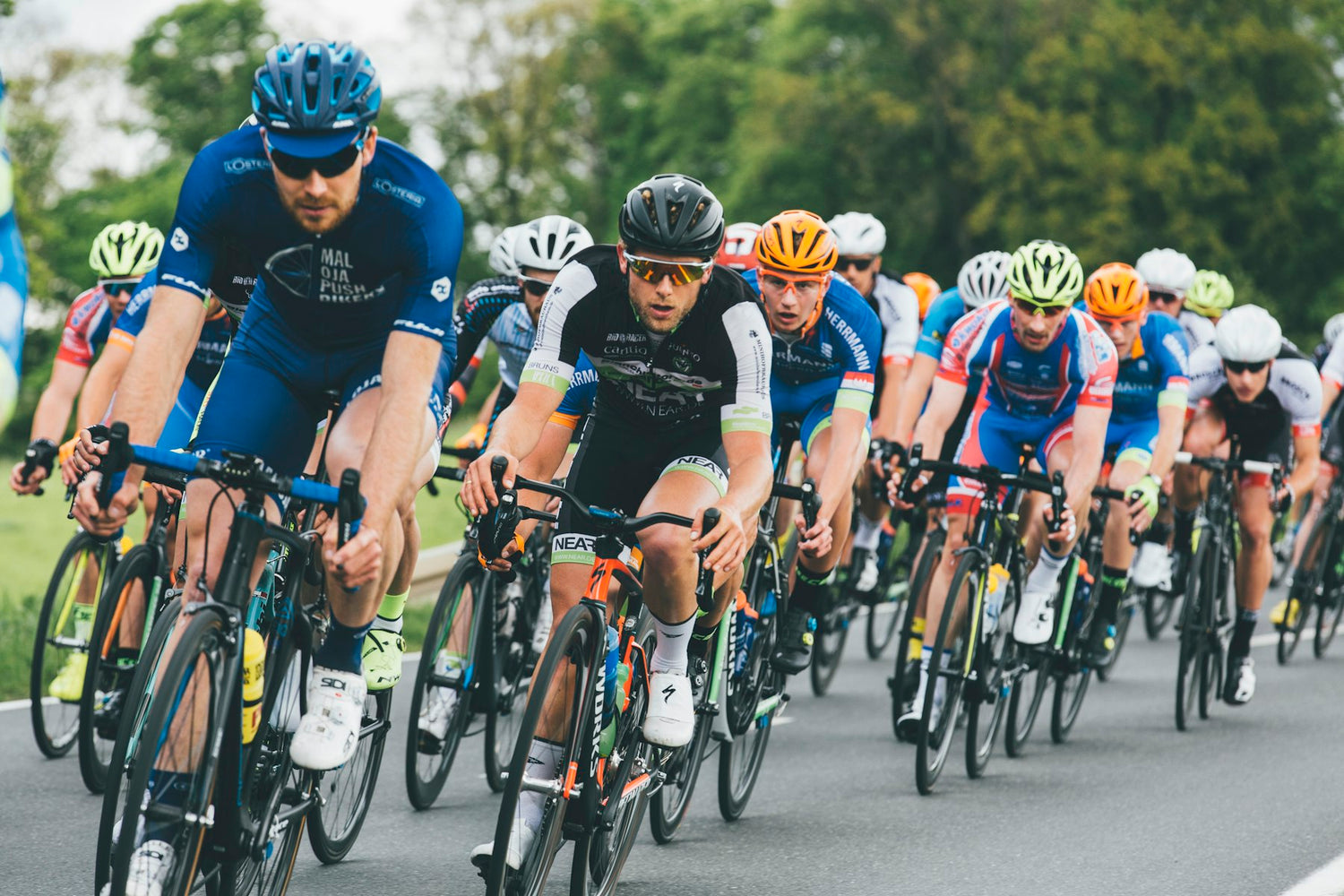 Peloton of road cyclists racing