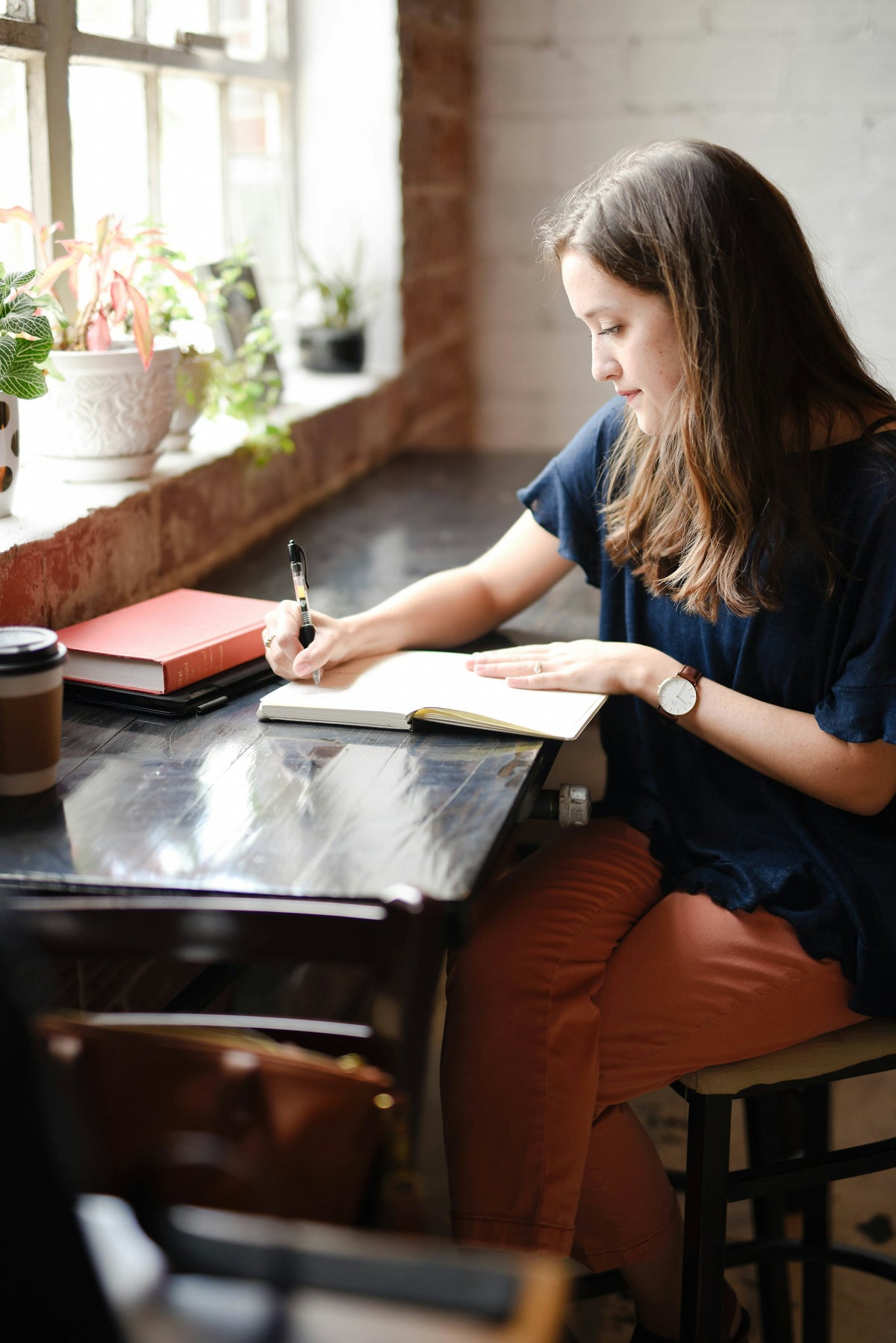 Writing by hand at a desk