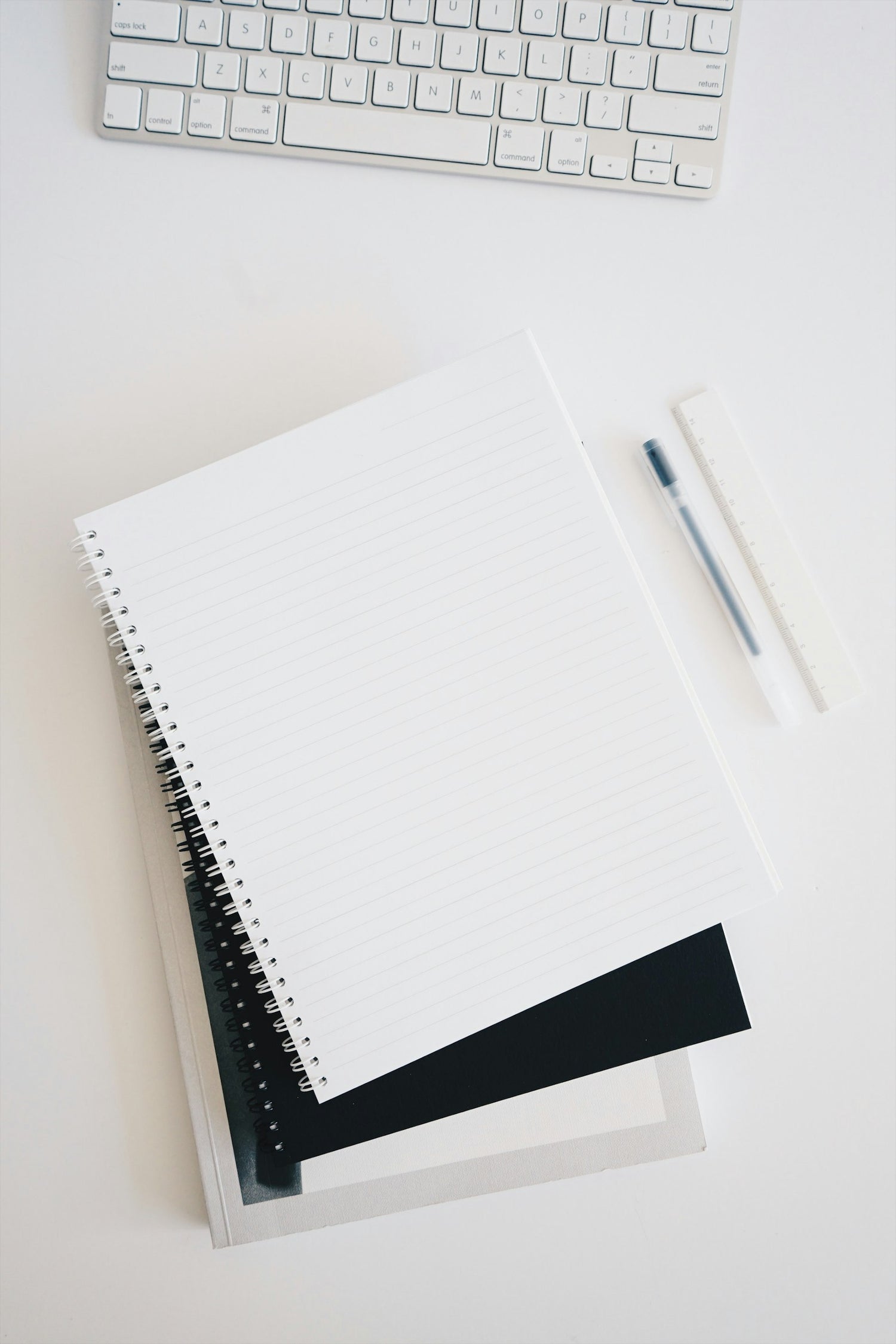 Blank notebook with a pencil
