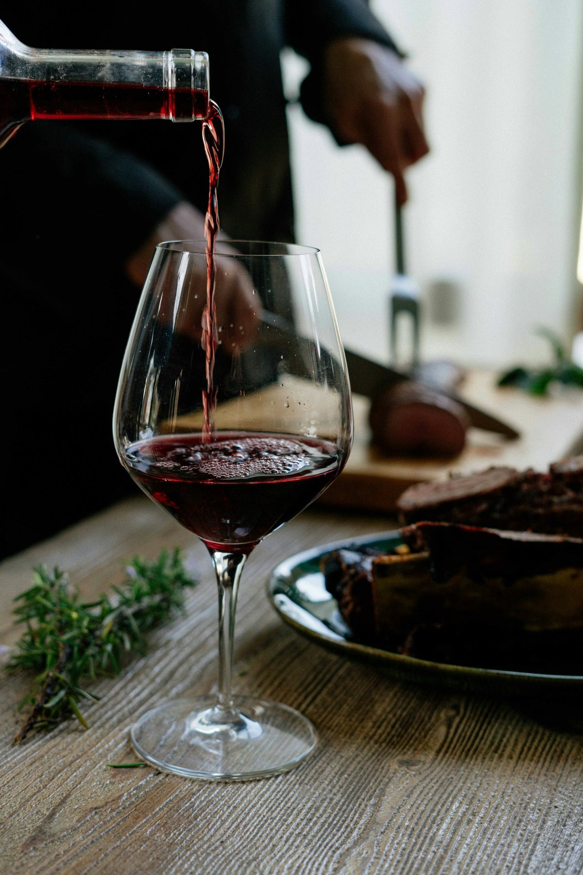 Red wine poured into a glass
