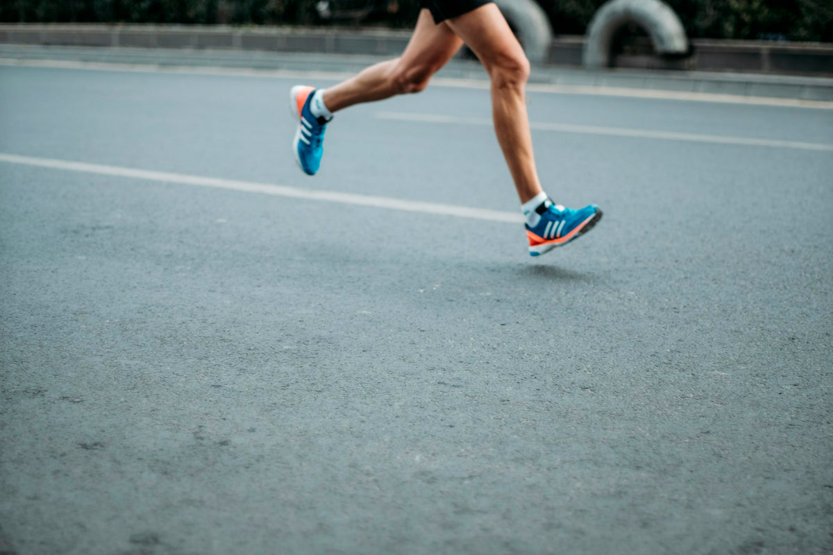 Runner mid stride on tarmac