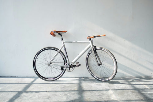 Commuter e-bike leaning against a wall