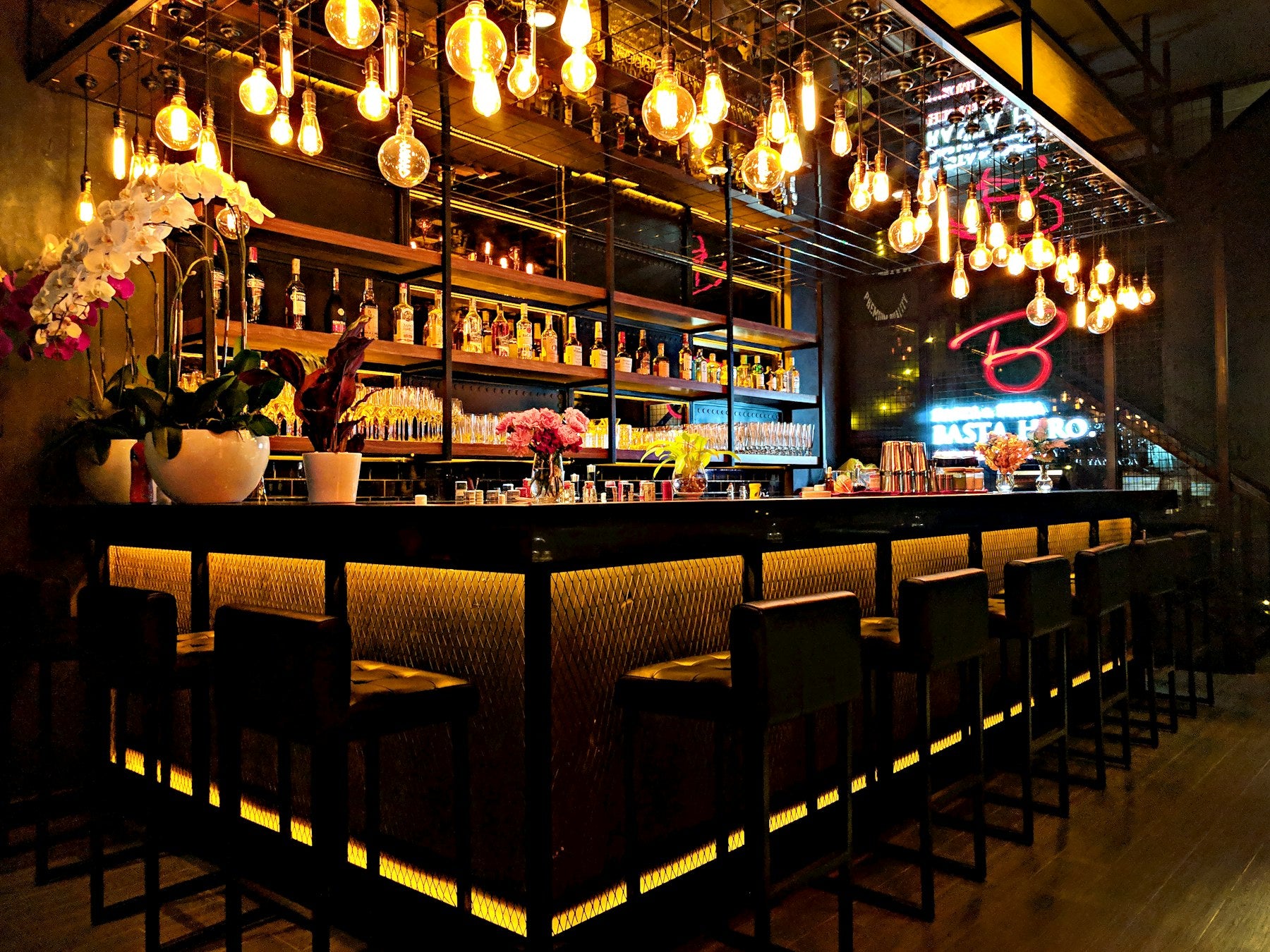 Lit cocktail bar interior at night