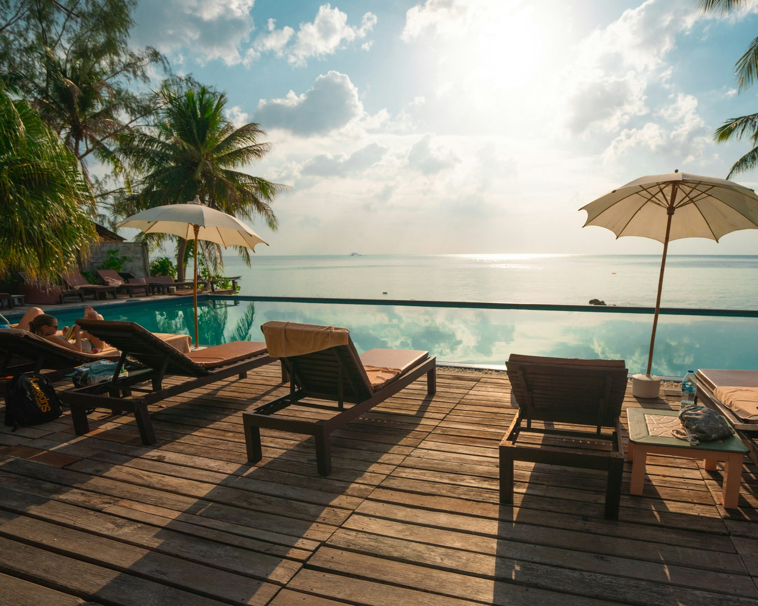 Sun loungers beside a pool