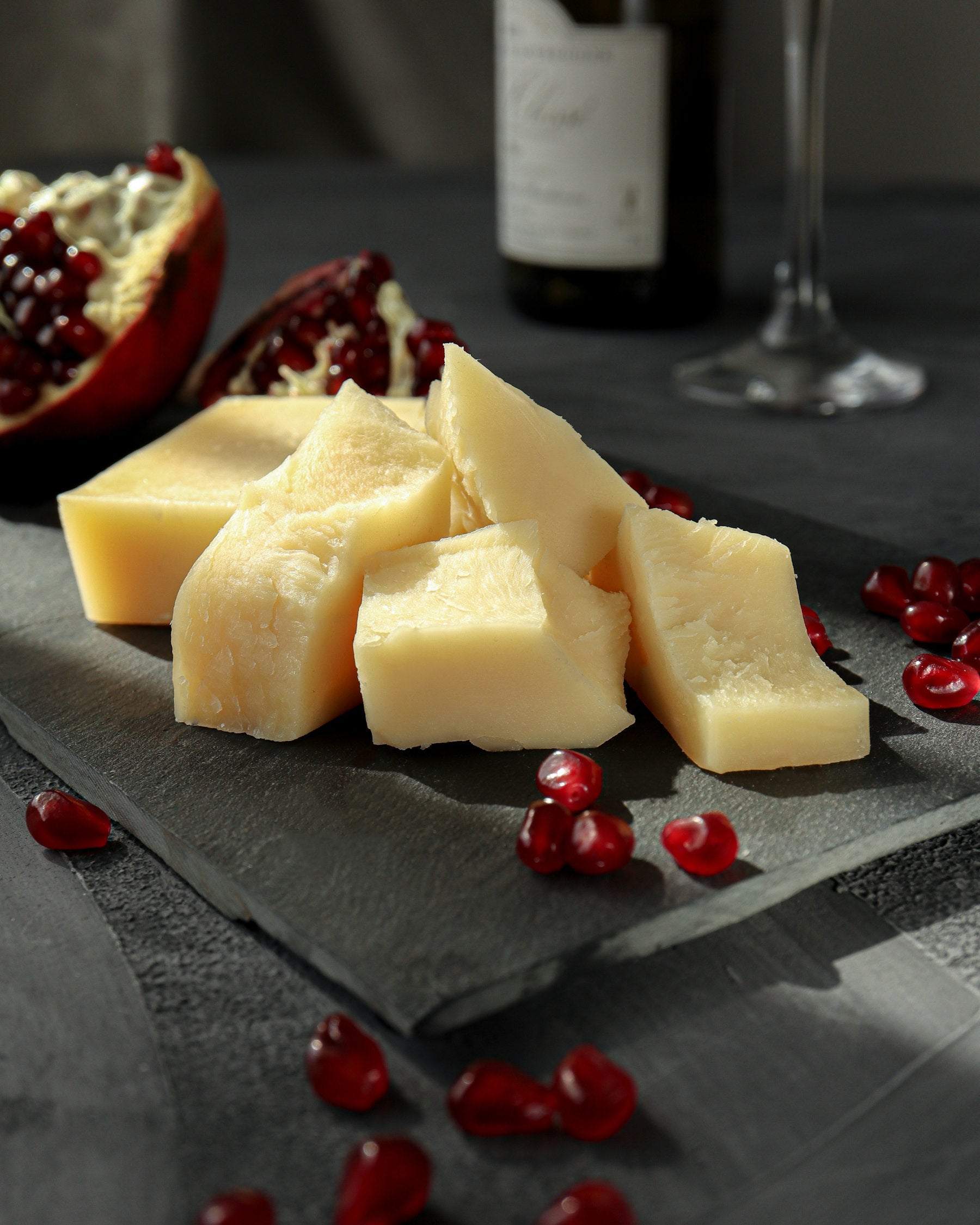 Cubes of hard cheese on slate