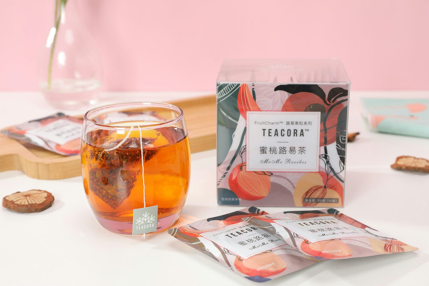 Loose leaf tea sachets and a glass
