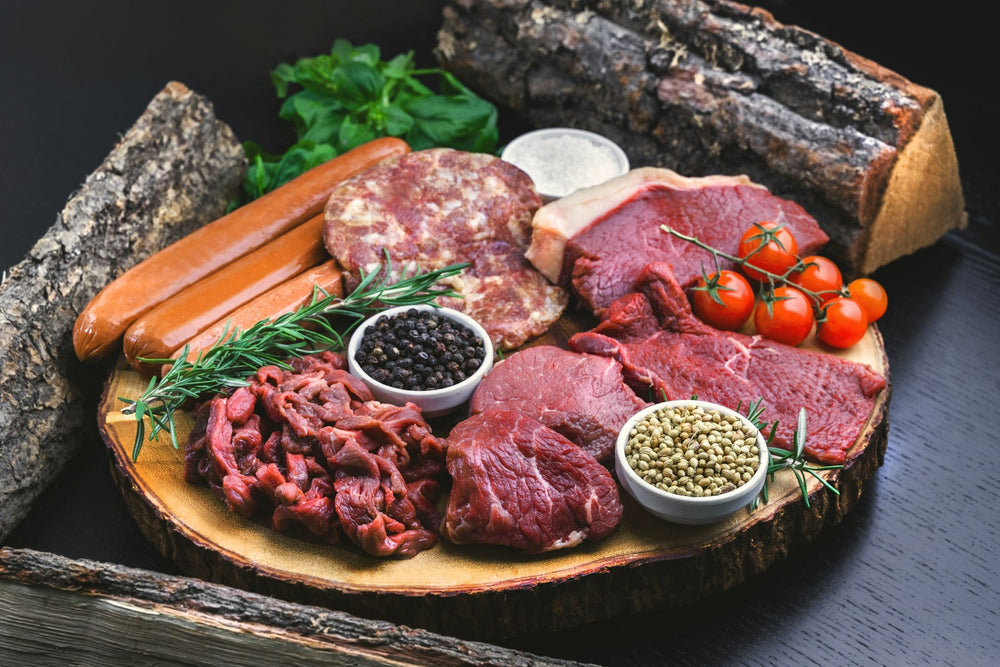 Butcher's board of cuts and herbs