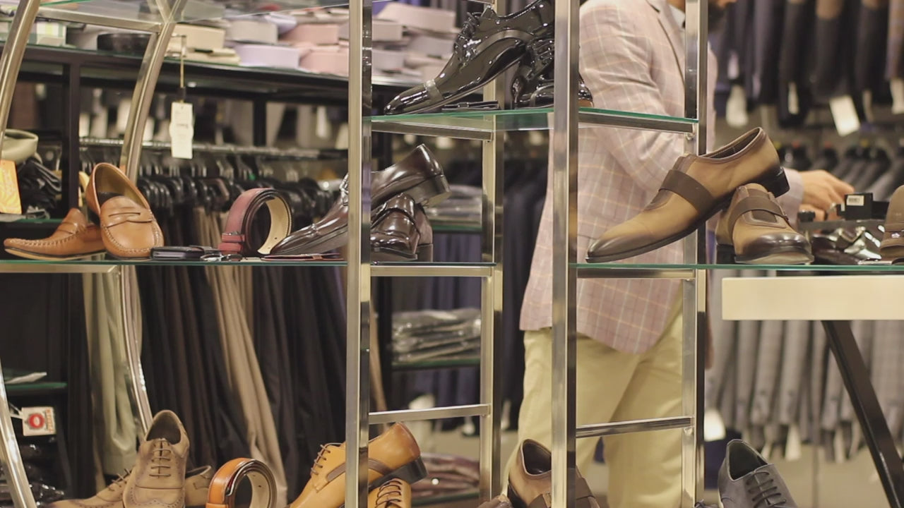 Shelves of leather shoes in a menswear shop