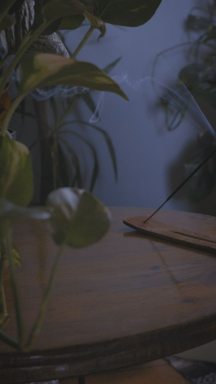Incense smoking on a low table beside a practice space
