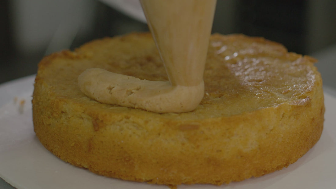 Cream poured over a sponge cake