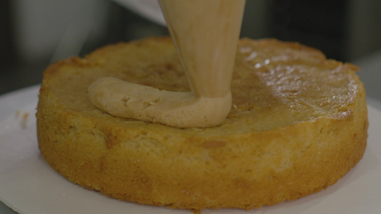 Cream poured over a sponge cake